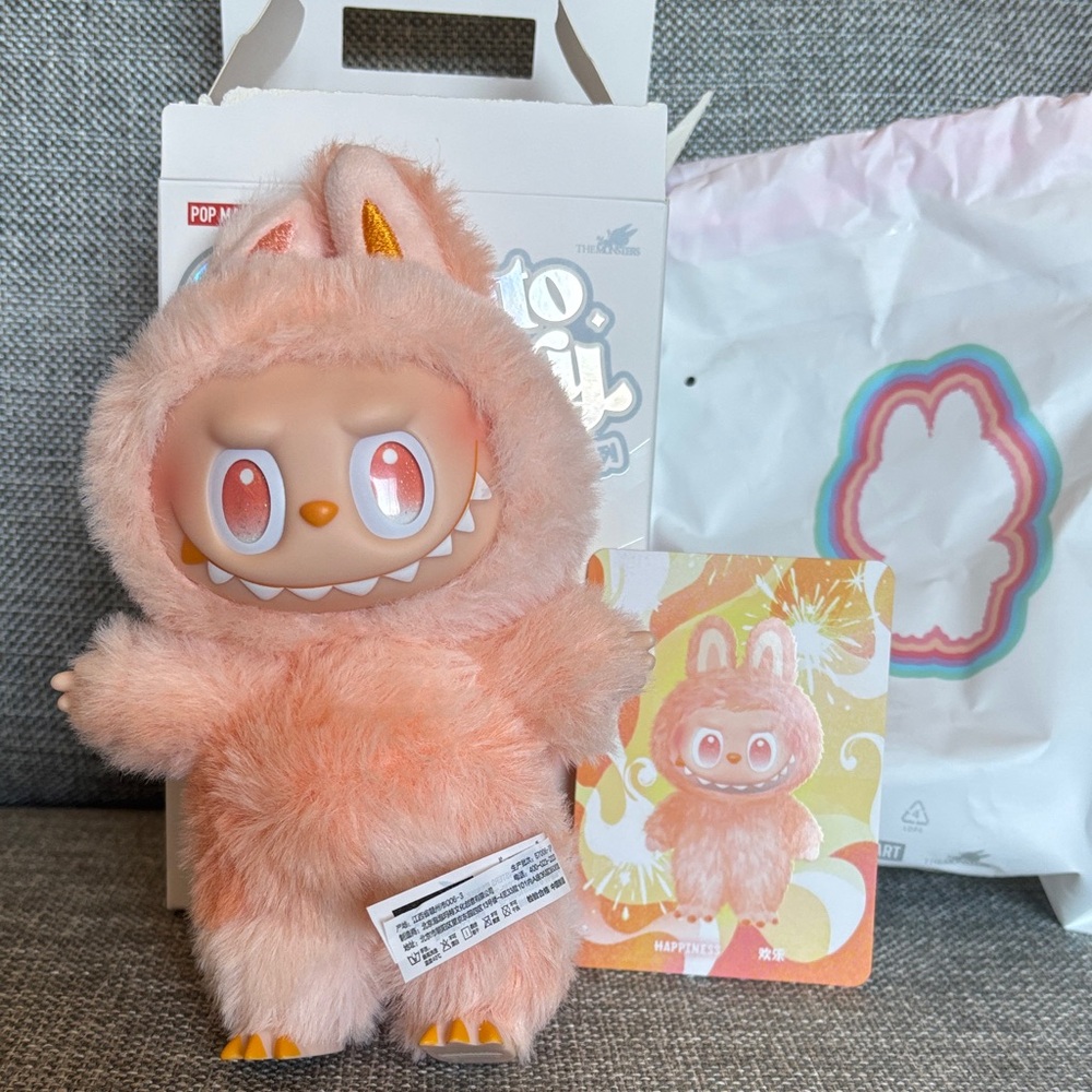 Adorable orange “Happiness” Labubu Big into Energy Bag Charm